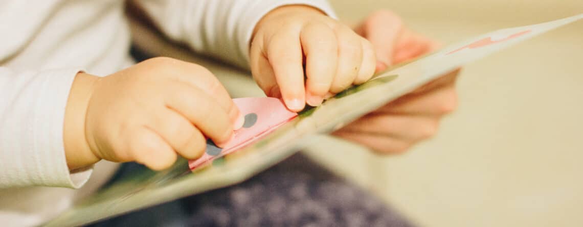 Toddler using stickers